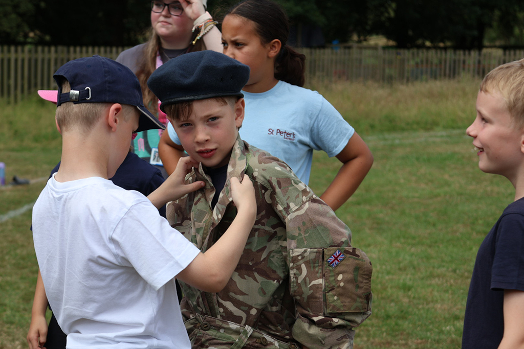 Students help each other to don disruptive pattern uniform